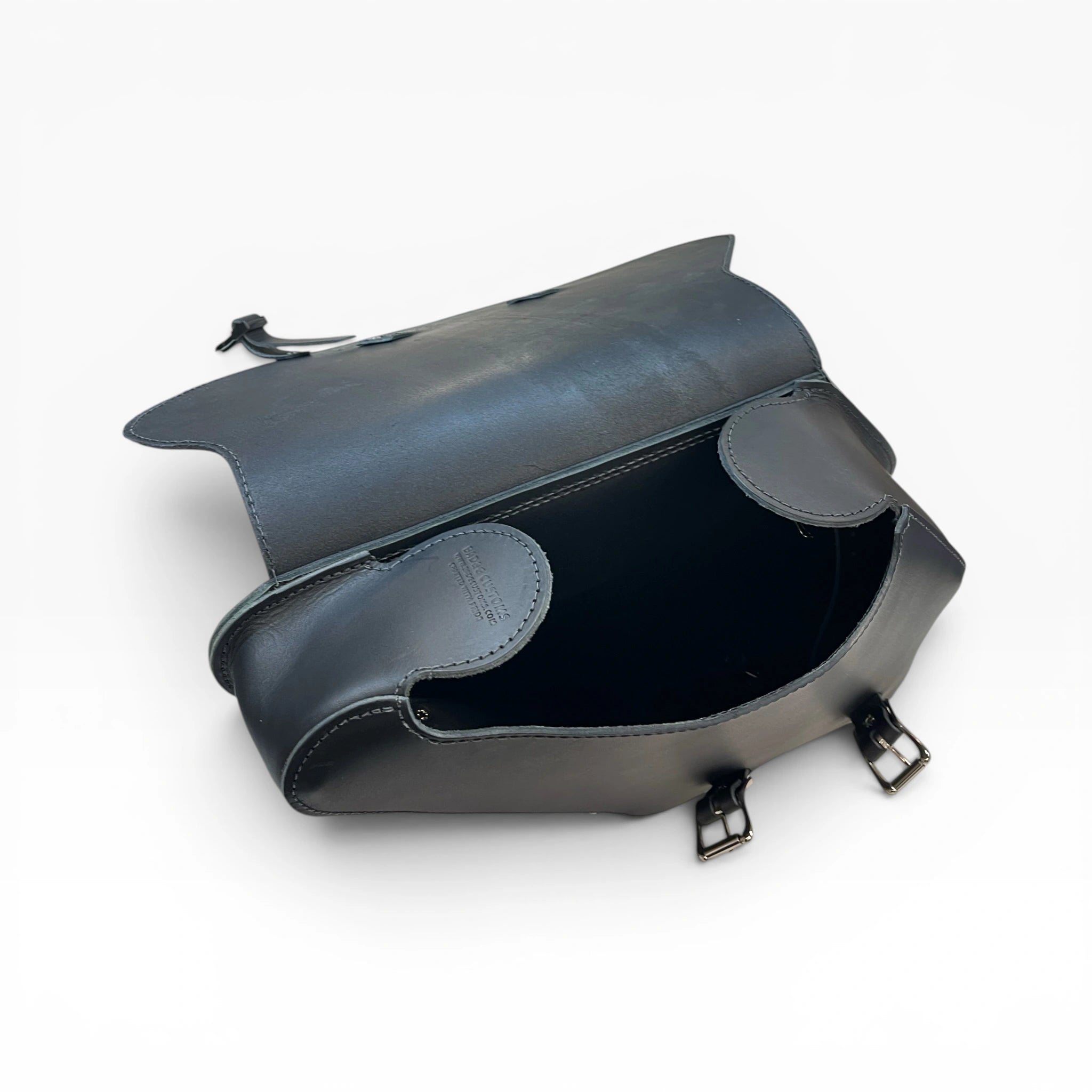 A dark gray leather shoulder bag shown open, displaying its interior lining and strap attachments, on a clean white background.