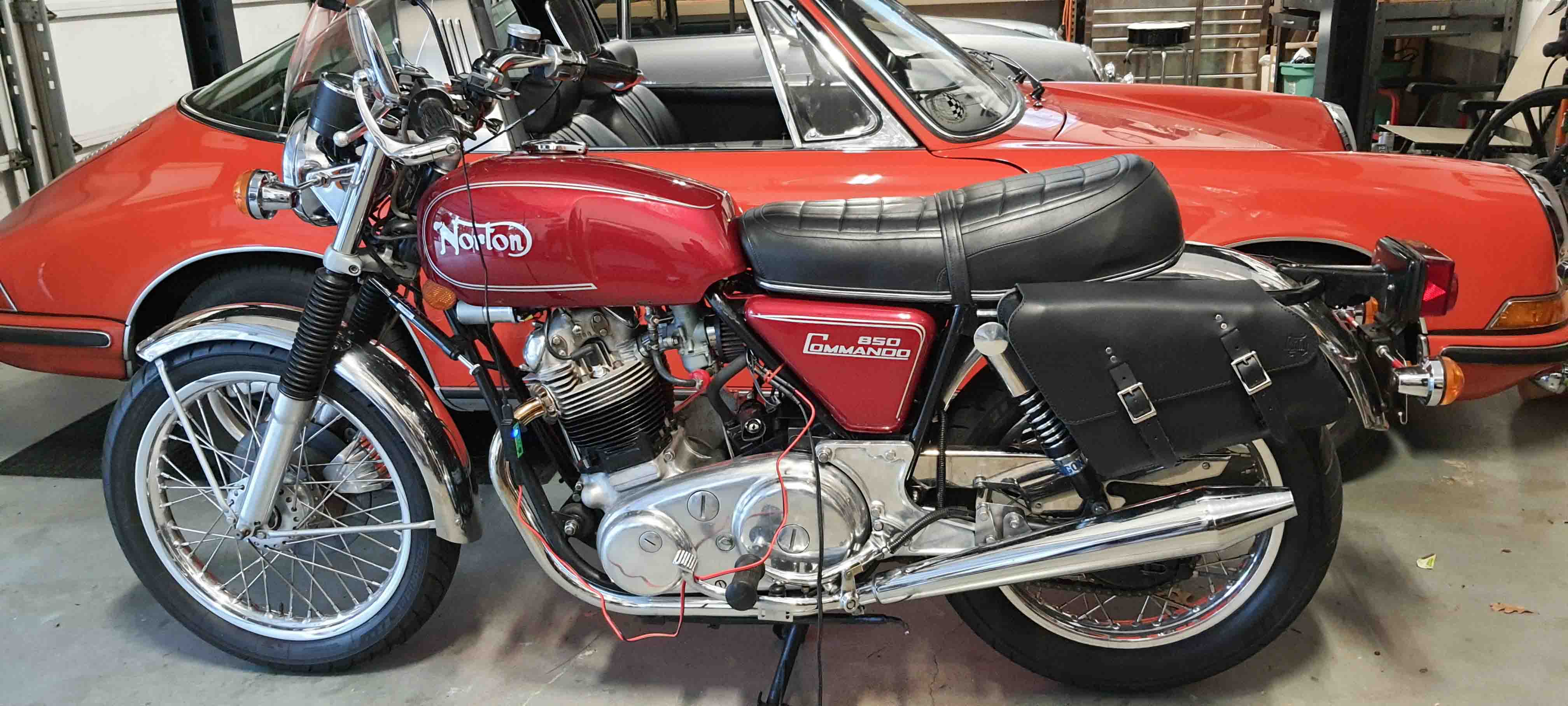 Norton Commando 850 classic motorcycle with vintage design and premium custom leather saddlebags for a perfect fit and timeless style.
