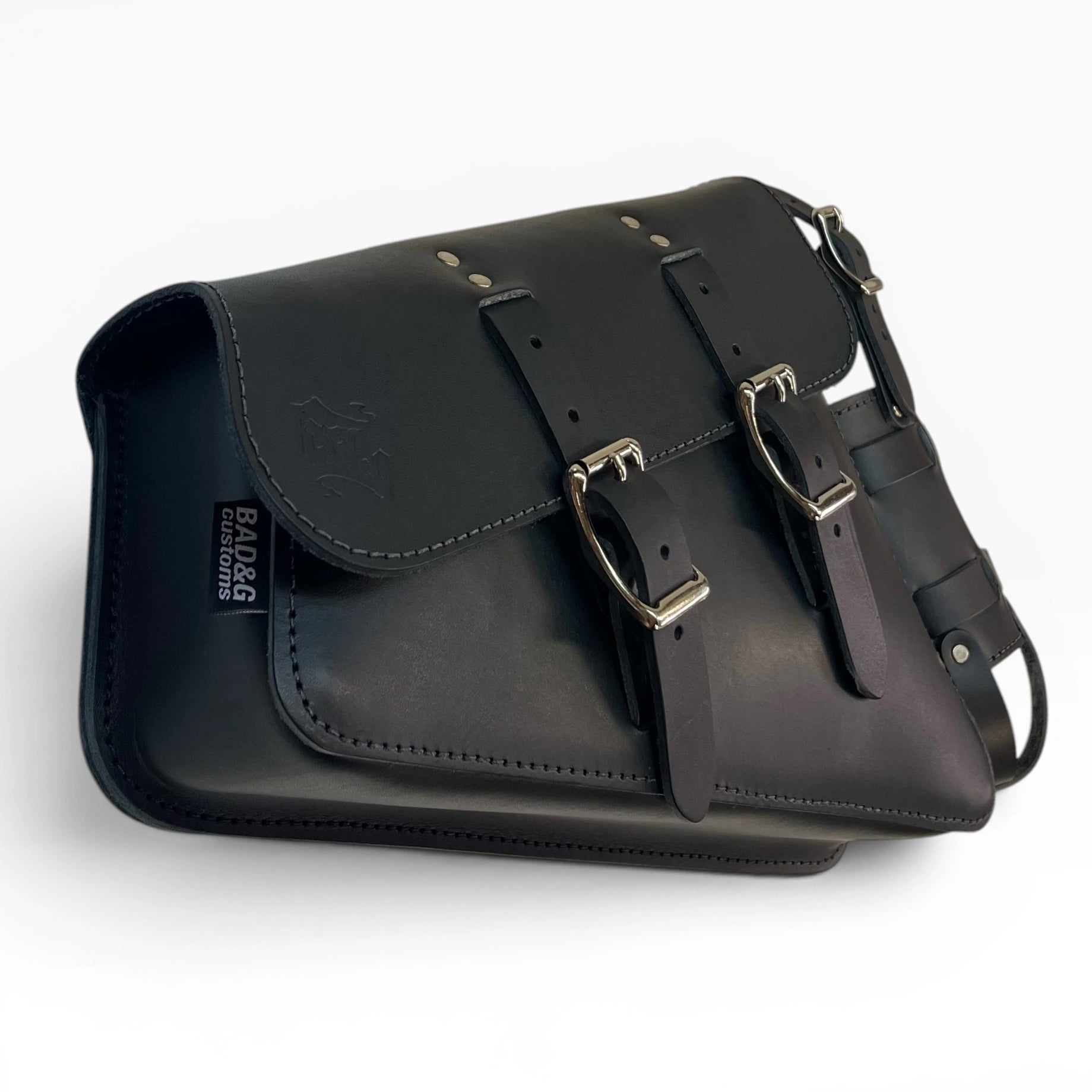 Black leather saddle bag with silver-tone buckles and a side strap, shown on a clean white background.