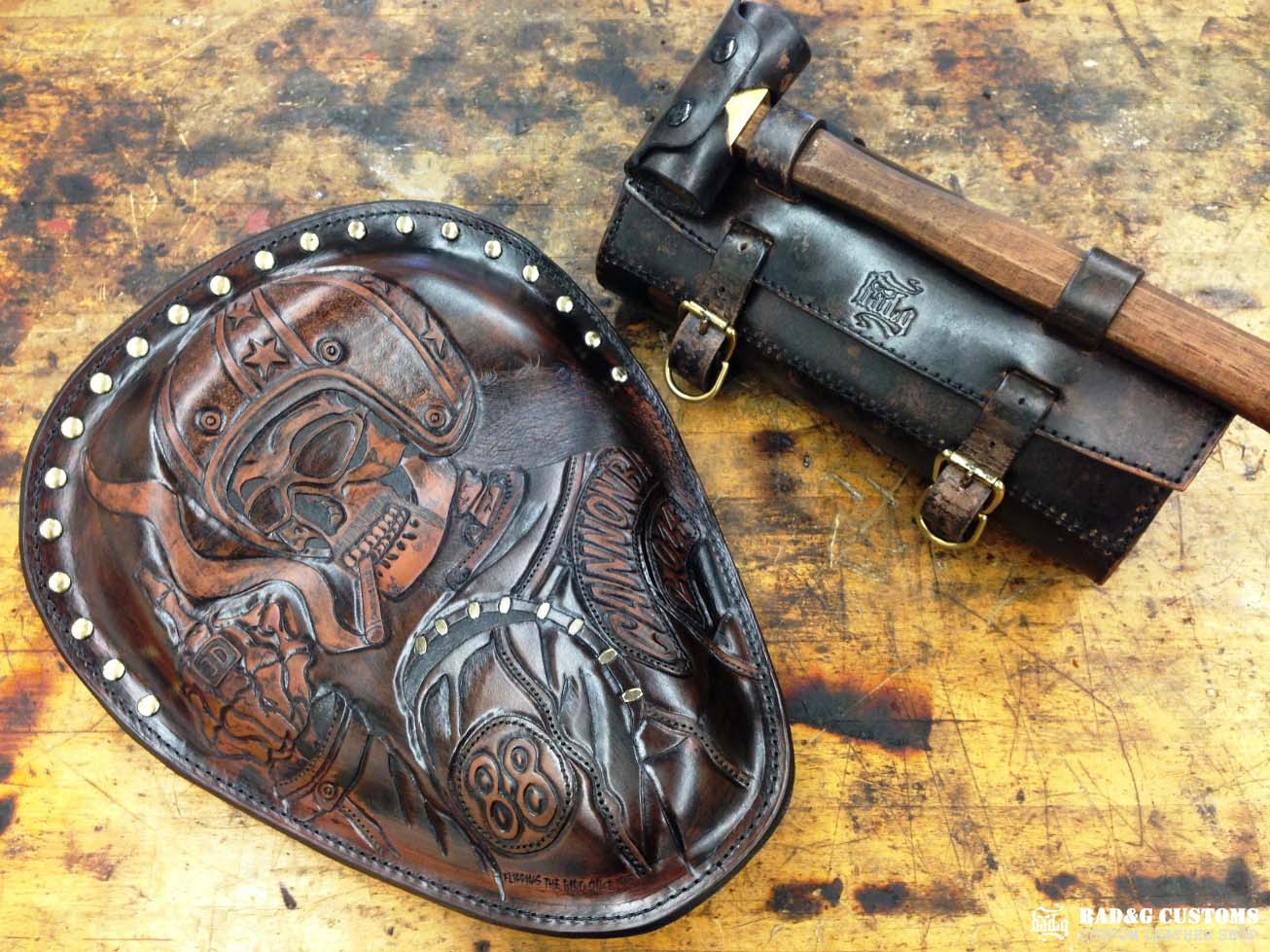 We’re proud to showcase a custom-made seat and saddlebags set crafted specifically for Doug Wothke, the legendary round-the-world motorcycle traveler. Made from hand-tooled and antiqued veg-tan leather, this set took countless hours of expert craftsmanship to complete. Designed for both durability and vintage authenticity, it will accompany him on the 2014 Cannonball Motorcycle Race, as he tackles this grueling challenge aboard his classic Harley-Davidson JD motorcycle. A true tribute to adventure!