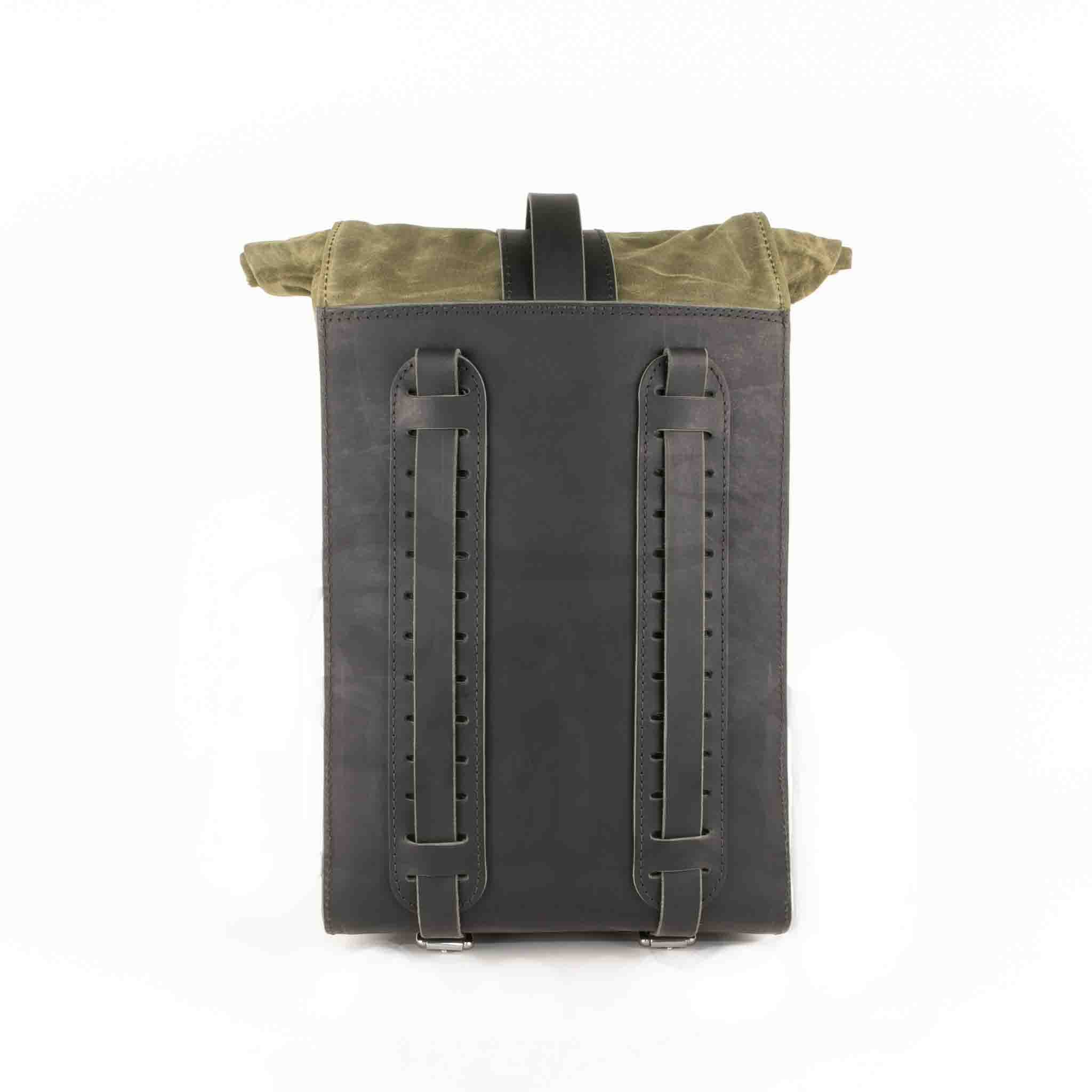 Upgrade your ride with the URB02 Rolltop Backpack Saddlebag. Unique design enables quick conversion from saddlebag to backpack. Hand crafted in USA with premium veg tan water buffalo leather, waxed canvas and stainless steel hardware. Durable and stylish, it's the perfect fit for your motorcycle.