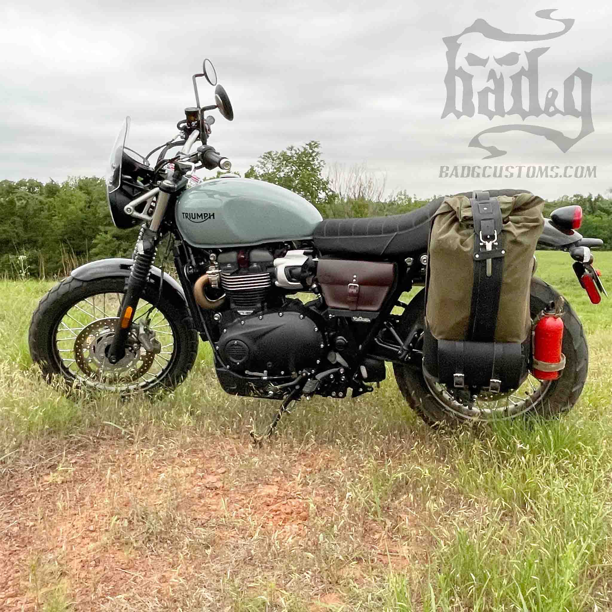 Upgrade your ride with the URB02 Rolltop Backpack Saddlebag. Unique design enables quick conversion from saddlebag to backpack. Hand crafted in USA with premium veg tan water buffalo leather, waxed canvas and stainless steel hardware. Durable and stylish, it's the perfect fit for your motorcycle.